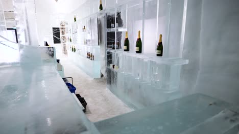 Large-ice-bar-with-drinks-in-Ice-Hotel-accommodation-in-northern-Sweden