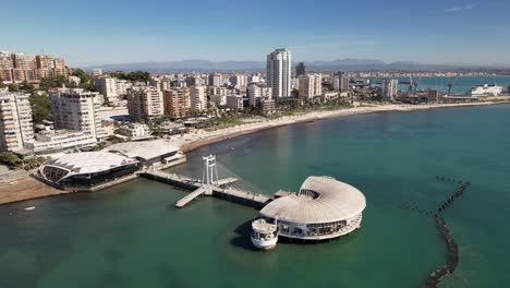 Coastal-city-of-Durres-with-holiday-resort-on-the-sea,-promenade,-buildings-and-hotels-for-tourists