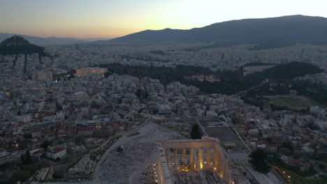 Aerial-tilt-up-shot-of-the-Acropolis-and-the-city-of-Athens-during-the-dawn