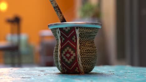 Pouring-hot-water-in-Argentinian-Mate-Tea-Cup-with-traditional-design