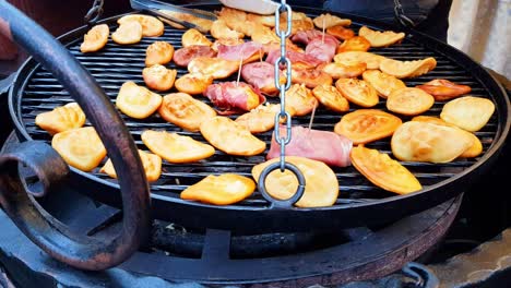 Making-polish-grilled-and-smoked-cheese,-oscypek-in-the-Christmas-fair-in-Krakow,-Poland