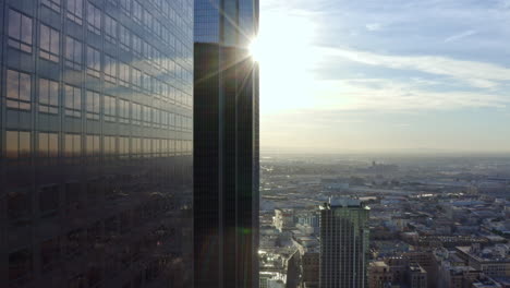 Ascending-shot-alongside-skyscrapers-reflecting-the-sun-in-downtown-Georgia