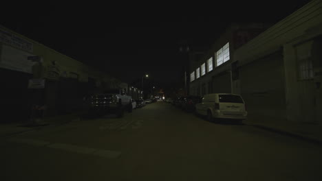 Cinematic-FPV-drone-shot-down-a-sidestreet-at-nighttime