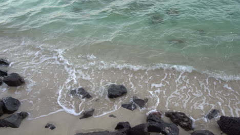 4K,-ocean-soft-waves-are-reaching-the-sandy-beach