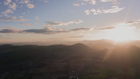 Aerial-view-of-a-sunset-between-the-mountains