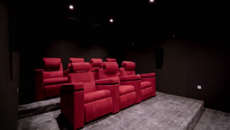 Revealing-shot-of-a-home-cinema-room-with-bright-red-chairs