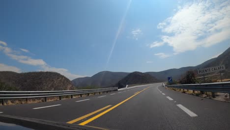 Driving-through-a-Mexican-highway-entering-the-state-of-Oaxaca