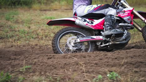 Racing-Motorcyclist-Scatters-Sand-Or-Dirt-With-Rear-Wheel