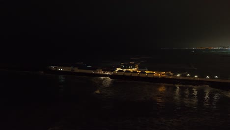 Aerial-orbits-Rosa-Nautica-Restaurant-on-Lima-jetty-in-black-of-night