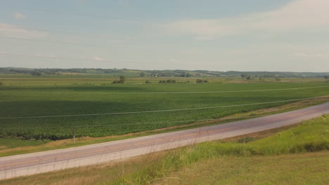 A-horizontal-camera-movement-over-the-rural-plains-in-the-midwest-of-the-USA-along-the-Lincoln-Highway