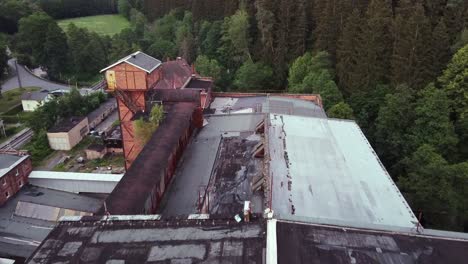 Devastating-aerial-view-of-a-lost-place-socialist-factory-in-former-GDR-in-the-middle-of-a-forest