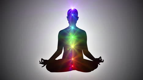 Silhouette-Einer-Person,-Die-In-Lotus-Yoga-Pose-Sitzt-Und-Nirvana-Oder-Erleuchtung-Erreicht-|-Sieben-Chakren