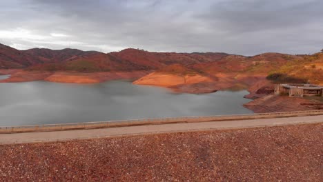 Low-water-levels-due-to-drought-in-Arade-Dam,-Algarve