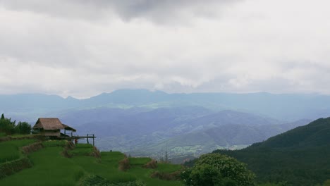 Time-lapse-of-clouded-sky-over-the-mountain-and-green-rice-terrace-at-Pa-Bong-Piang-in-Chiang-Mai,-Thailand