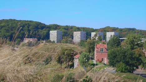 Static-wide-shot-of-urban-housing-complex-beyond-Gdansk-during-beautiful-summer-day
