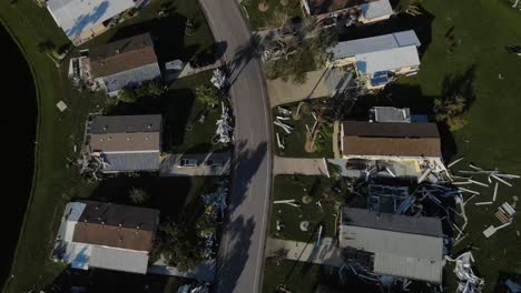 dreamlike-spinning-overhead-aerial-of-damage-to-a-mobile-home-park-in-Venice,-Florida-after-hurricane-Ian