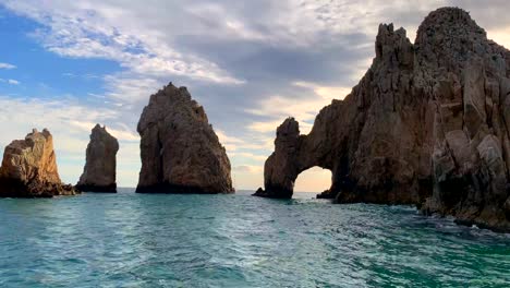 Wide,-sunset-of-beautiful,-famous-Cabo-San-Lucas-sea-arch-El-Arco-at-Land's-End-promotory,-Playa-del-Amor-at-Cabo-san-Lucas,-Baja-California-Sur,-mexico-in-4k,-static-shot