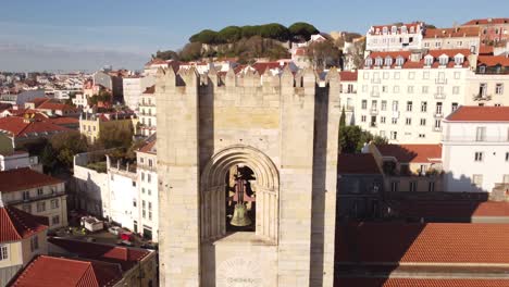 Spectacular-top-drone-view-starting-from-the-bells-of-the-Catedral-Sé-Patriarcal-Igreja-de-Santa-Maria-Maior-in-Alfama-Lisbon-Portugal-Europe