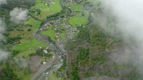 Areal-shoot-at-could-level-revealing-small-village-in-Norway