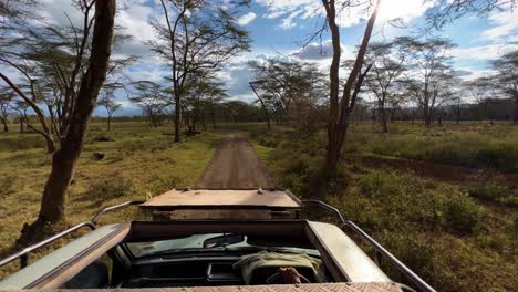Safari-Vehicle-With-Top-Open-Driving-On-Savannah-Of-Lake-Nakuru-National-Parks-In-Kenya