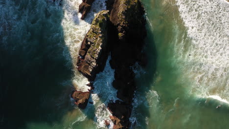 Top-down-aerial-drone-of-a-rocky-coastline-in-the-Mediterranean-sea