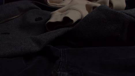 Mens-warm-clothes-left-on-bed