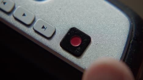Closeup-record-button-release-videotaping-videography-gear