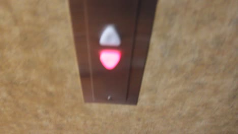 Elevator-buttons-being-pressed-to-go-down