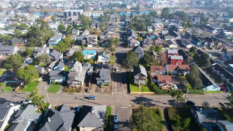 4K-aerial-drone-shot-floating-over-houses-at-Seaside,-Oregon-on-a-sunny-day