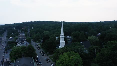 Drone-flying-around-church-tower-reveal-coastal-scenery-of-Maine-Harbor,-United-States