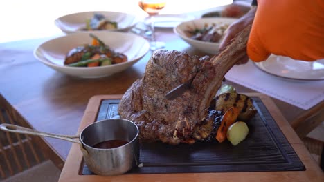 Cutting-beef-steak.-An-incredible-roast..
