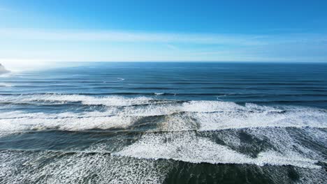 4K-aerial-drone-shot-floating-overlooking-Seaside,-Oregon-ocean-on-a-sunny-day