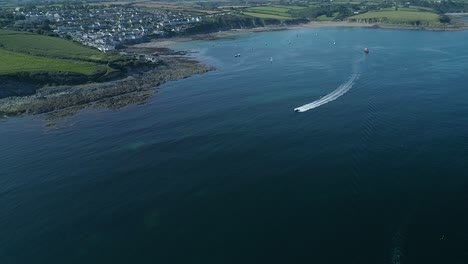 View-of-the-coastline-at-Portscatho,-Cornwall,-UK-on-a-beautiful-summer-morning,-aerial-shot