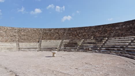 Ancient-limestone-amphitheater-in-city-of-Salamis-in-Cyprus-island,-pan-left-view