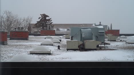 Rooftop-wide-shot-of-the-apartment-building-in-winter-time-with-HVAC-system