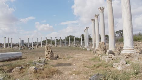 Marble-column-remains-of-antique-city-of-Salamis,-dolly-forward-view