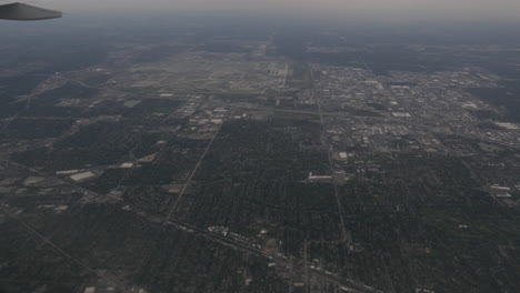 Aerial-view-of-Chicago-Illinois-over-Chicago-O'hare-Airport-out-of-plane-window-4k