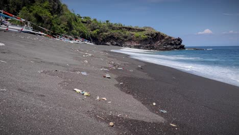 Plastic-Garbage-Scattered-On-Sandy-Shore-At-The-Beach-In-Bali,-Indonesia