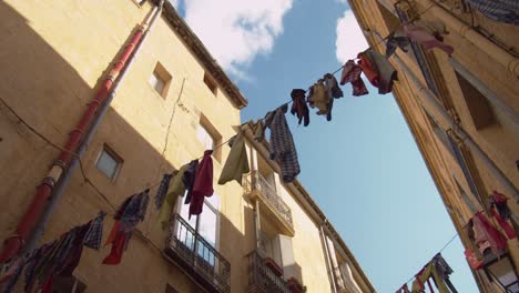 Drying-Clothes-Hanging-Out-To-Dry-Across-The-Typical-Street-In-Montpellier,-France