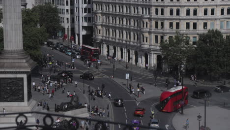 High-view-of-busy-crossing-at-Trafalgar-square-London,-view-from-The-Roof-Top-bar