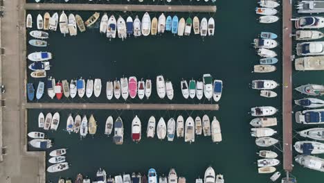 Top-down-view-of-marina-full-of-boats