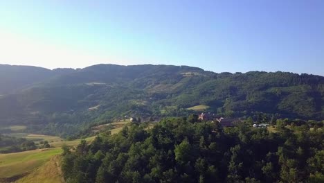 Aerial-push-shot-towards-hilltop-farm-chalet-in-the-French-ArdÃ¨che-region