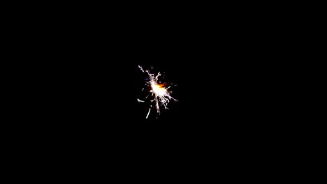 Sparks-shooting-off-sparkler-fireworks-isolated-on-black-background