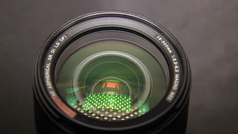 Close-Up-of-DSLR-Camera-Lens-in-the-Dark