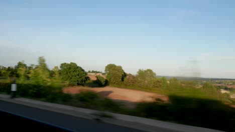 Shot-of-the-Countryside-from-a-Moving-Car