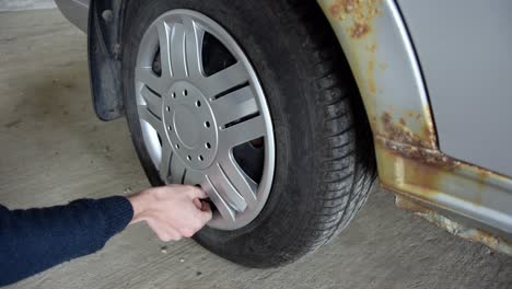 Repair-man-checking-tire-pressure