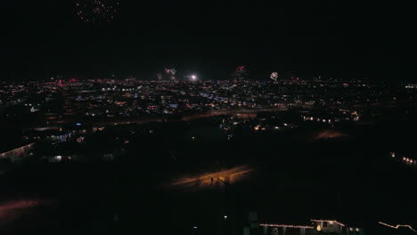 Dolly-forward-through-city-during-fireworks