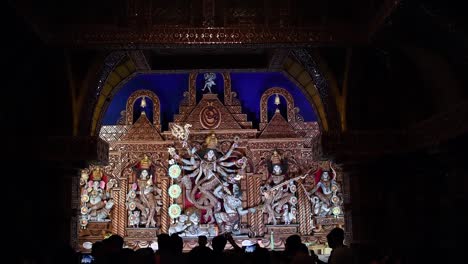 Indian-Visitors-taking-photos-of-Hindu-Goddess-Durga-idol-in-pandals-or-temples-in-festival-season