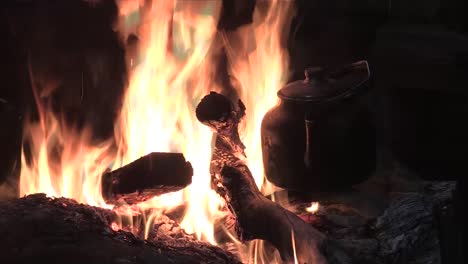 Middle-shot-of-woodfire-and-cookinpot-with-water