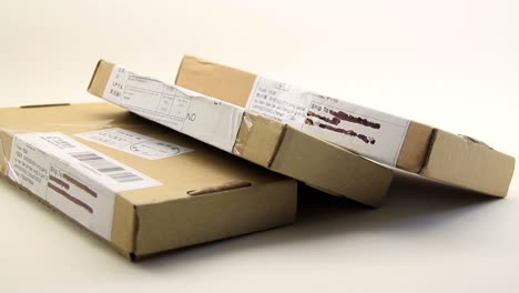 Close-Up-Of-Three-Parcel-Packages